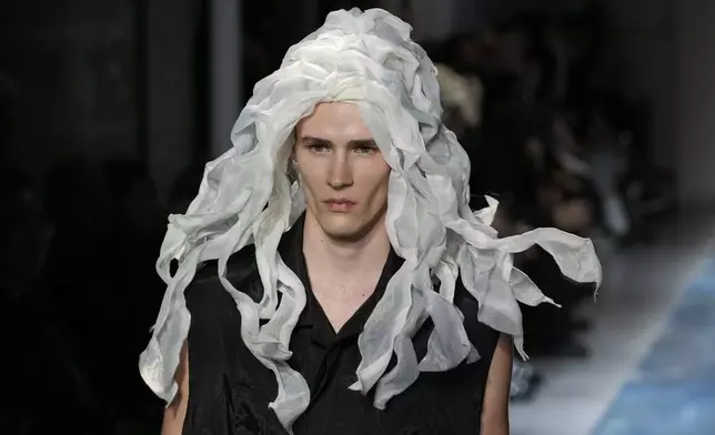 A model wears a creation part of the men's Yohji Yamamoto Spring-Summer 2026 collection, that was presented in Paris Thursday, June 26, 2025. (AP Photo/Michel Euler)