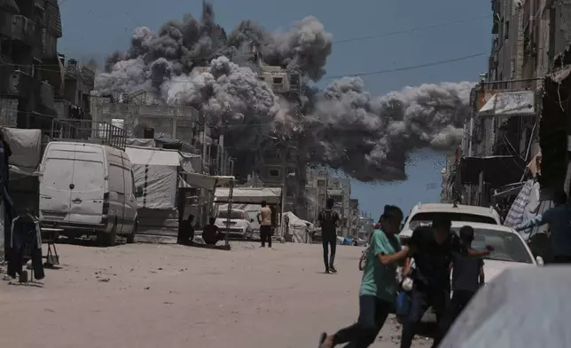 Smoke rises to the sky following an Israeli strike in Gaza City, Sunday, June 1, 2025. (AP Photo/Jehad Alshrafi)