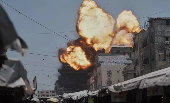 Thick smoke and flames erupt from an Israeli airstrike in Gaza City, Sunday, June 1, 2025. (AP Photo/Jehad Alshrafi)