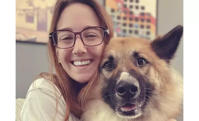 This undated photo released by Frankie Jackson, a UK-registered veterinary nurse and certified animal behavior consultant, shows Jackson with her dog, Rook, at her home in Smyrna, Ga. (AP Photo/Frankie Jackson)