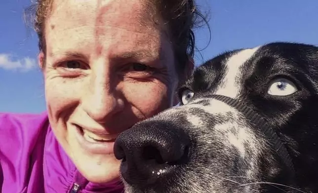 This undated photo released by Dr. Becky Peters, a veterinarian and owner of Bath Veterinary Hospital in Bath, N.Y., shows Peters with her dog, (AP Photo/Becky Peters)