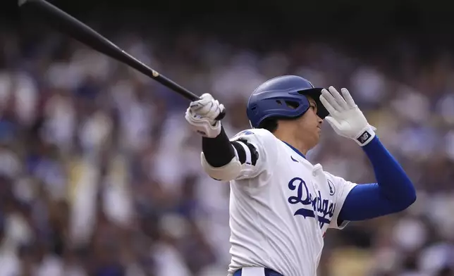 Los Angeles Dodgers' Shohei Ohtani takes a strike during the first inning of a baseball game against the New York Yankees, Sunday, June 1, 2025, in Los Angeles. (AP Photo/Mark J. Terrill)