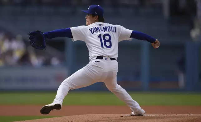 Los Angeles Dodgers starting pitcher Yoshinobu Yamamoto throws to the plate during the first inning of a baseball game against the New York Yankees, Sunday, June 1, 2025, in Los Angeles. (AP Photo/Mark J. Terrill)