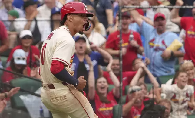 St. Louis Cardinals' Masyn Winn celebrates after scoring during the eighth inning of a baseball game against the Los Angeles Dodgers Saturday, June 7, 2025, in St. Louis. (AP Photo/Jeff Roberson)