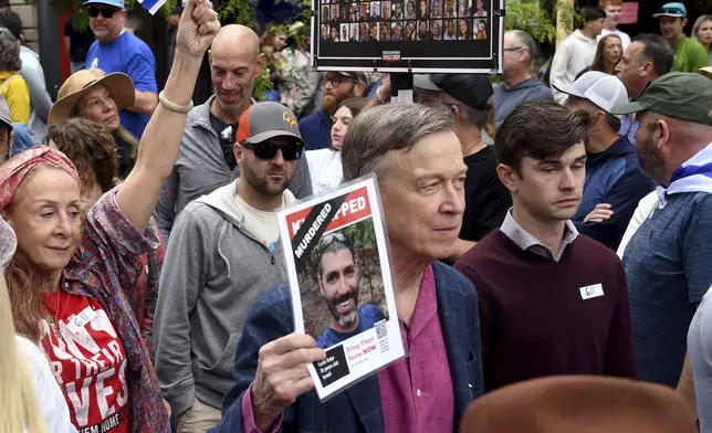 U.S. Sen. John Hickenlooper marches during a rally at the Boulder Jewish Festival in Boulder, Colo., on Sunday, June 8, 2025.(AP Photo/Thomas Peipert)