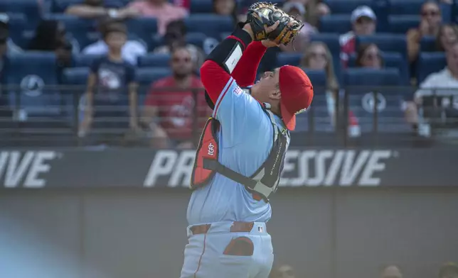 St. Louis Cardinals' St. Louis Cardinals' Yohel Pozo catches a pop foul by Cleveland Guardians' Austin Hedges during the sixth inning of a baseball game, Saturday, June 28, 2025, in Cleveland. (AP Photo/Phil Long)