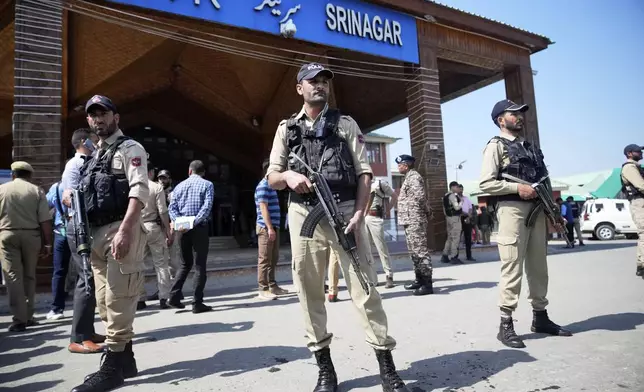Security personnel stand guard outside the Srinagar railway station, from where Vande Bharat Express train is soon to be inaugurated to run between Srinagar and Katra, in Srinagar, Indian controlled Kashmir, Friday, June 6, 2025. (AP Photo/Dar Yasin)