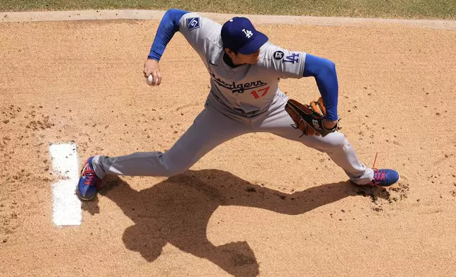 Los Angeles Dodgers starting pitcher Shohei Ohtani warms up before a baseball game against the Kansas City Royals, Saturday, June 28, 2025, in Kansas City, Mo. (AP Photo/Charlie Riedel)