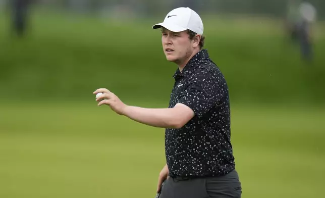 Robert MacIntyre, of Scotland, reacts to his birdie putt on the 14th hole during the final round of the U.S. Open golf tournament at Oakmont Country Club Sunday, June 15, 2025, in Oakmont, Pa. (AP Photo/Seth Wenig)
