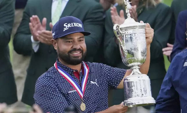 J.J. Spaun celebrates with the trophy after winning the U.S. Open golf tournament at Oakmont Country Club Sunday, June 15, 2025, in Oakmont, Pa. (AP Photo/Gene J. Puskar)