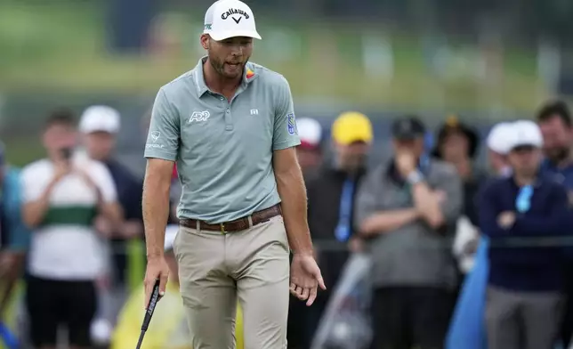 Sam Burns reacts to a missed putt on the 14th hole during the final round of the U.S. Open golf tournament at Oakmont Country Club Sunday, June 15, 2025, in Oakmont, Pa. (AP Photo/Seth Wenig)