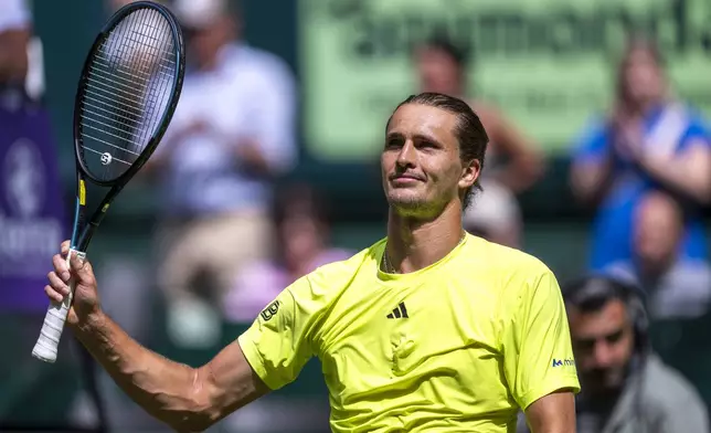 Germany's Alexander Zverev reacts after his match against USA's Marcos Giron during the Halle ATP tennis tournament in Halle, Germany, Wednesday, June 18, 2025. (David Inderlied/dpa via AP)