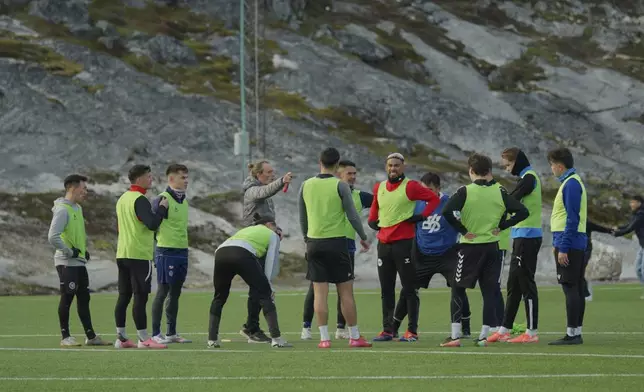 Greenland's soccer and futsal players huddle during a training session at Nuuk stadium in Nuuk, Greenland, Tuesday, June 17, 2025. (AP Photo/Kwiyeon Ha)