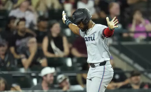 Miami Marlins' Otto Lopez celebrates his two-run home run against the Arizona Diamondbacks during the ninth inning of a baseball game Friday, June 27, 2025, in Phoenix. (AP Photo/Ross D. Franklin)