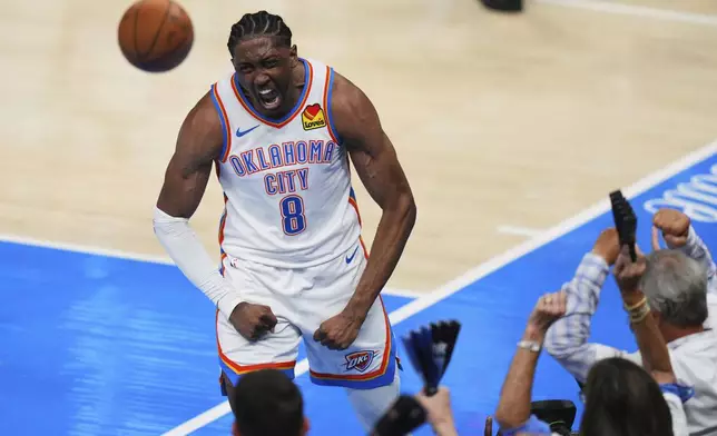 Oklahoma City Thunder forward Jalen Williams (8) celebrates after a dunk during the second half of Game 1 of the NBA Finals basketball series against the Indiana Pacers Thursday, June 5, 2025, in Oklahoma City. (AP Photo/Nate Billings)