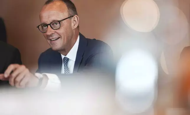 German Chancellor Friedrich Merz arrives for the cabinet meeting at the chancellery in Berlin, Germany, Wednesday, June 4, 2025. (AP Photo/Markus Schreiber)
