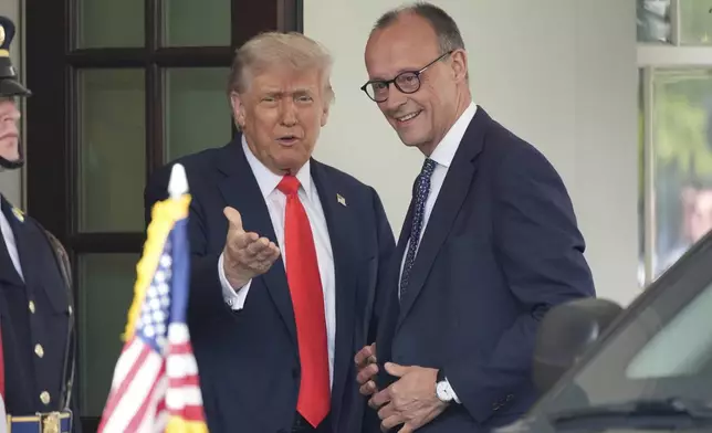President Donald Trump, left, greets Germany's Chancellor Friedrich Merz upon his arrival at the White House, Thursday, June 5, 2025, in Washington. (AP Photo/Alex Brandon)