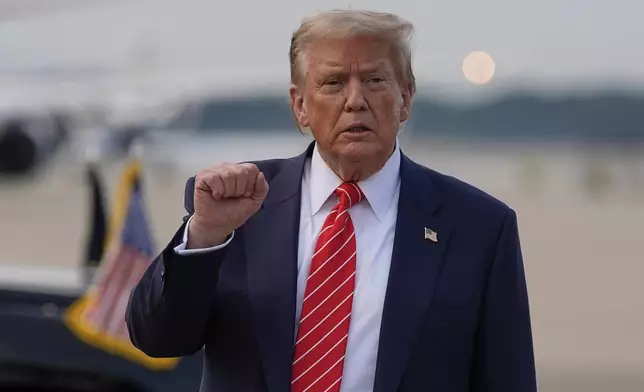 President Donald Trump gestures after arriving on Air Force One, Wednesday, June 25, 2025, at Joint Base Andrews, Md. (AP Photo/Alex Brandon)