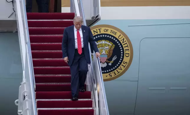 President Donald Trump exits Air Force One at Joint Base Andrews, Md., Wednesday, June 25, 2025. (AP Photo/Cliff Owen)