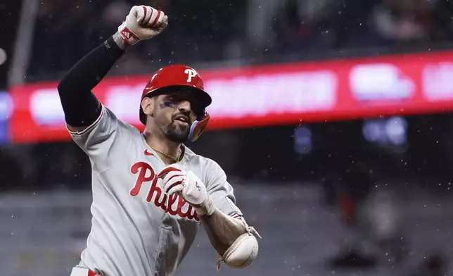 Philadelphia Phillies' Nick Castellanos reacts after hitting a home run during the second inning of a baseball game against the Atlanta Braves, Friday, June 27, 2025, in Atlanta. (AP Photo/Butch Dill)