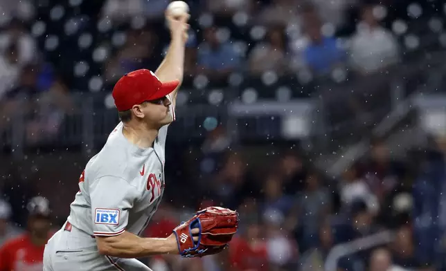 Philadelphia Phillies pitcher Tanner Banks throws during the first inning of a baseball game against the Atlanta Braves, Friday, June 27, 2025, in Atlanta. (AP Photo/Butch Dill)