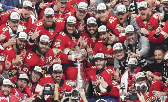 The Florida Panthers celebrate with the Stanley Cup after defeating the Edmonton Oilers in Game 6 of the NHL hockey Stanley Cup Final in Sunrise, Fla., Tuesday, June 17, 2025. (Nathan Denette/The Canadian Press via AP)