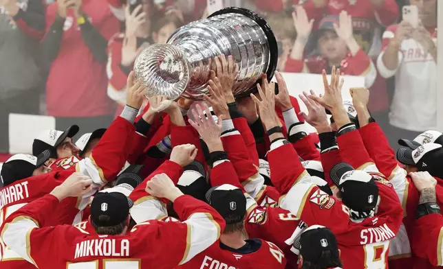 The Florida Panthers raise the Stanley Cup after defeating the Edmonton Oilers in Game 6 of the NHL hockey Stanley Cup Final in Sunrise, Fla., Tuesday, June 17, 2025. (Nathan Denette/The Canadian Press via AP)