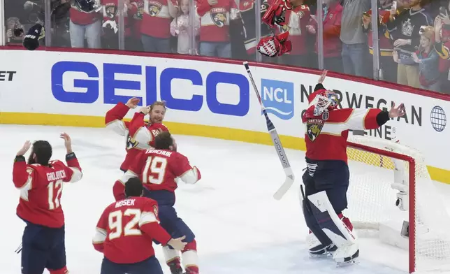 Florida Panthers goalie Sergei Bobrovsky (72) and teammates celebrate after defeating the Edmonton Oilers in Game 6 of the NHL hockey Stanley Cup Final in Sunrise, Fla., Tuesday, June 17, 2025. (Nathan Denette/The Canadian Press via AP)