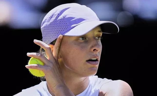 Poland's Iga Swiatek wipes her face during the final match at the WTA tennis tournament against US Jessica Petula in Bad Homburg, Germany, Saturday, June 28, 2025. (AP Photo/Michael Probst)