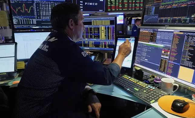 Trader Leon Montana works on the floor of the New York Stock Exchange, Tuesday, June 3, 2025. (AP Photo/Richard Drew)