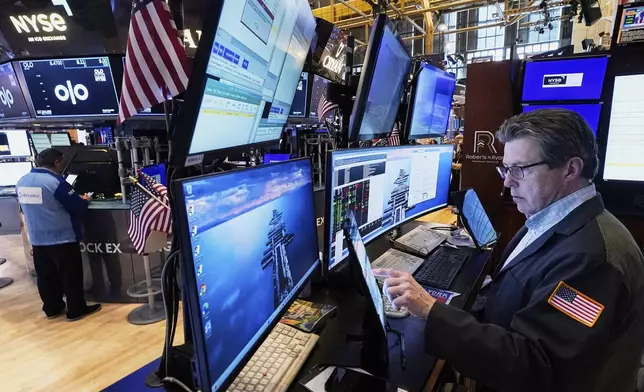 Trader James Matthews works on the floor of the New York Stock Exchange, Tuesday, June 3, 2025. (AP Photo/Richard Drew)