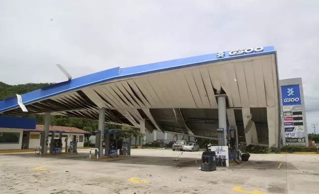 A gas station is damaged after Hurricane Erick hit near San Jose del Progreso, Oaxaca state, Mexico, Thursday, June 19, 2025. (AP Photo/Luis Alberto Cruz)