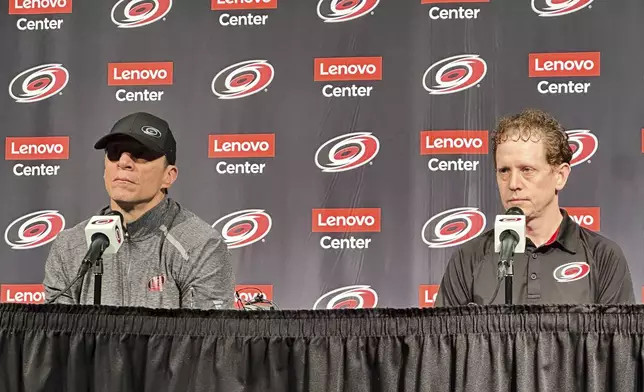 Carolina Hurricanes coach Rod Brind’Amour, left, and gneral manager Eric Tulsky speak during an end-of-year NHL hockey news conference, Tuesday, June 3, 2025, in Raleigh, N.C. (AP Photo/Aaron Beard)