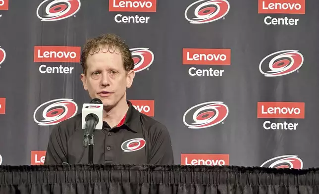 Carolina Hurricanes general manager Eric Tulsky speaks during an end-of-year NHL hockey news conference, Tuesday, June 3, 2025, in Raleigh, N.C. (AP Photo/Aaron Beard)