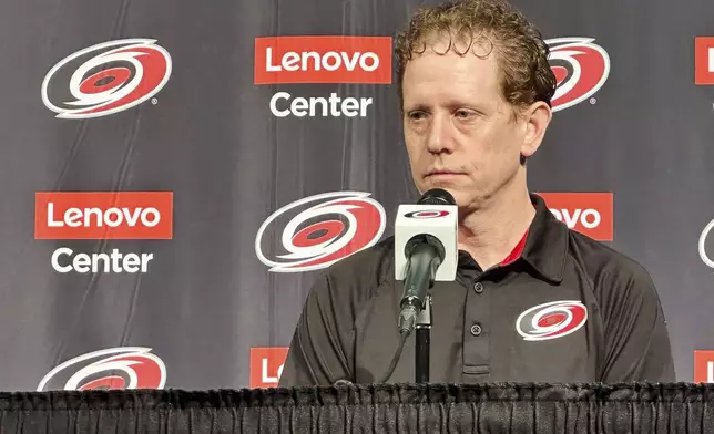 Carolina Hurricanes general manager Eric Tulsky speaks during an end-of-year NHL hockey news conference, Tuesday, June 3, 2025, in Raleigh, N.C. (AP Photo/Aaron Beard)