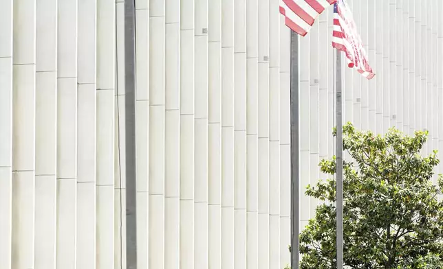 U.S Marines patrol alongside a federal building in Los Angeles, Friday, June 13, 2025. (AP Photo/Noah Berger)