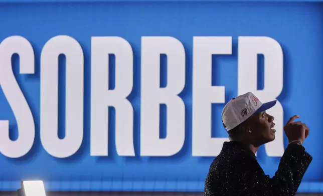 Thomas Sorber reacts as he walks off the stage after being selected 15th by the Oklahoma City Thunderin the first round of the NBA basketball draft, Wednesday, June 25, 2025, in New York. (AP Photo/Adam Hunger)
