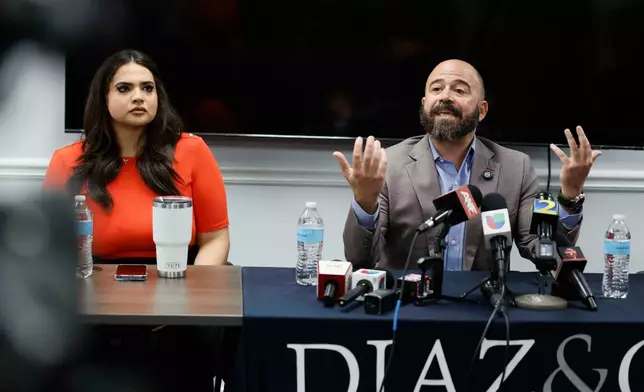 Giovanni Diaz, alongside Katherine Guevara, speaks during a press conference about the status of Mario Guevara, a metro Atlanta-based Spanish-language reporter from MGNews, addressing his situation following his arrest while covering an immigration rally, Tuesday, June 17, 2025, in Smyrna, Ga. (Miguel Martinez/Atlanta Journal-Constitution via AP)