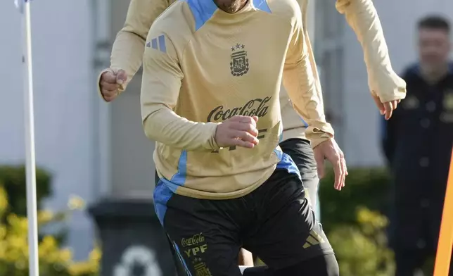 Argentina's Lionel Messi, front, and Leandro Paredes train ahead of a World Cup 2026 qualifier against Chile at the Argentina Soccer Association in Buenos Aires, Argentina, Tuesday, June 3, 2025. (AP Photo/Gustavo Garello)