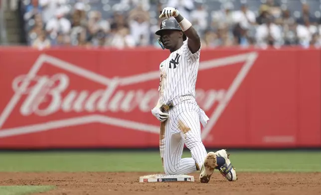 New York Yankees' Jazz Chisholm Jr. reacts after hitting a double during the second inning of a baseball game against the Baltimore Orioles Sunday, June 22, 2025, in New York. (AP Photo/Pamela Smith)