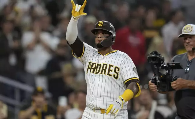 San Diego Padres' Martín Maldonado celebrates after hitting a home run during the fifth inning of a baseball game against the Washington Nationals Tuesday, June 24, 2025, in San Diego. (AP Photo/Gregory Bull)