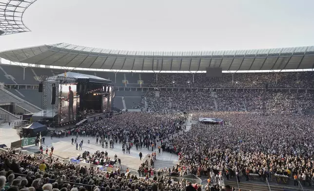 Bruce Springsteen performs with the E Street Band at the Olympic Stadium in Berlin, Germany, Wednesday, June 11, 2025. (AP Photo/Markus Schreiber)