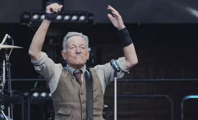 Bruce Springsteen performs with the E Street Band at the Olympic Stadium in Berlin, Germany, Wednesday, June 11, 2025. (AP Photo/Markus Schreiber)