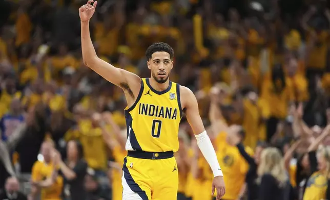 Indiana Pacers guard Tyrese Haliburton (0) celebrates during the second half of Game 6 of the Eastern Conference finals of the NBA basketball playoffs against the New York Knicks in Indianapolis, Saturday, May 31, 2025. (AP Photo/Michael Conroy)