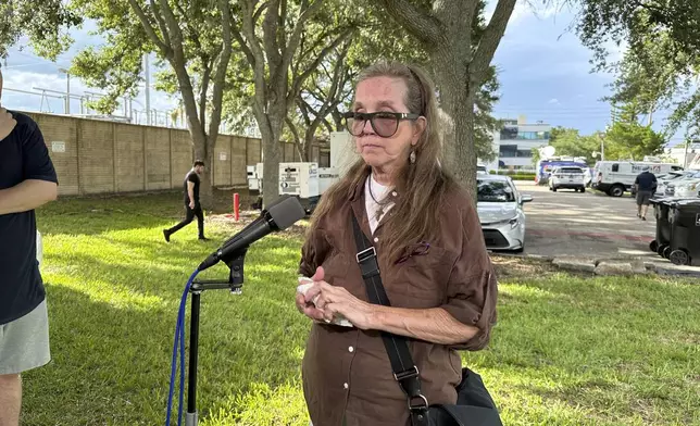 Christine Leinonen, whose son, Christopher "Drew" Leinonen was killed in the Pulse nightclub massacre in 2016, talks to reporters after walking through the venue as part of a group of survivors and family members of those killed, on Wednesday June 11, 2025 in Orlando, Florida. (AP Photo/Mike Schneider)