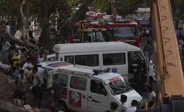 Search and rescue teams respond to the scene of a plane crash in Ahmedabad, India, Thursday, June 12, 2025. (AP Photo/Ajit Solanki)