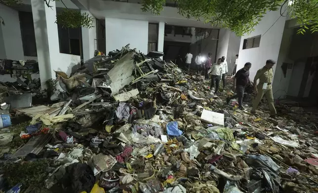 Search and recovery teams work through the rubble of a plane crash in Ahmedabad, India, Thursday, June 12, 2025. (AP Photo/Ajit Solanki)