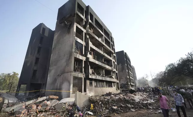 Search and rescue teams respond to the scene of a plane crash in Ahmedabad, India, Thursday, June 12, 2025. (AP Photo/Ajit Solanki)