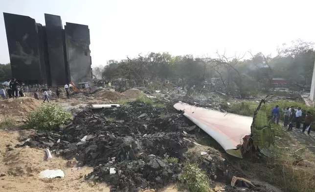 The debris of an airplane lie scattered after it crashed in India's northwestern city of Ahmedabad in Gujarat state, Thursday, June 12, 2025. (AP Photo/Ajit Solanki)