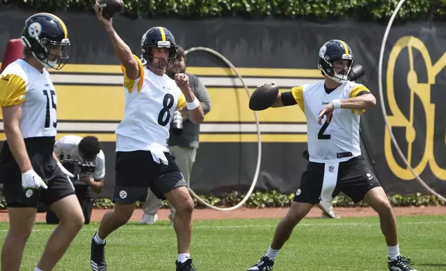 Pittsburgh Steelers quarterbacks Aaron Rodgers (8) and Mason Rudolph (2) throw during practice at NFL football minicamp, Tuesday, June 10, 2025, in Pittsburgh. (AP Photo/Gene J. Puskar)